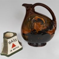 2-x-vintage-Bar-ware-items-inc-C-1900-Minton-pottery-Bass-Brewery-match-holder-and-striker-approx-8cm-H-and-a-Doulton-Navy-Kingsware-Dewar-whisky-ju-Sold-for-75-2020