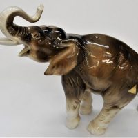 Post-1960s-Bohemia-Czech-Royal-Dux-porcelain-elephant-with-raised-trunk-numbered-with-pink-triangle-mark-to-base-approx-21cm-H-Sold-for-37-2020