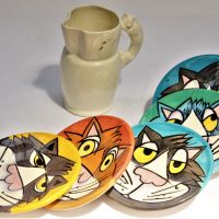 Group-Lot-Pottery-Cat-Themed-incl-Comical-Cat-wall-plaques-and-white-jug-with-Cat-handle-Sold-for-56-2019