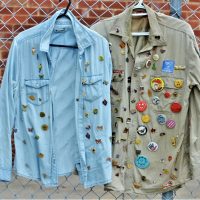 2-x-shirts-covered-with-badges-and-pins-inc-DRUG-SQUAD-De-Law-is-De-Law-assorted-political-scouting-tourism-badges-etc-Sold-for-68-2020