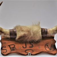 Pair-of-bull-horns-mounted-on-wooden-back-with-pyrography-lettering-Sold-for-50-2020