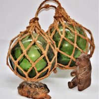 Small-lot-inc-glass-nautical-buoys-with-original-woven-rope-hanging-basket-carved-wooden-bear-figurine-and-ceramic-hare-figurine-Sold-for-50-2020