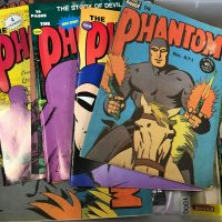Box-lot-vintage-THE-PHANTOM-comics-mostly-Ca-70s-80s-AND-boxed-pin-bookmark-tiepin-set-Sold-for-137-2020