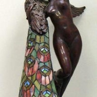 Heavy reproduction bronze & leadlight lamp with statue base of lady embracing peacock, bears signature to base - Sold for $298 - 2016