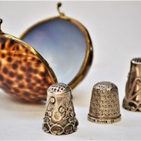 Group-lot-3-x-vintage-Thimbles-incl-Sterling-silver-shell-box-with-gilt-mounts-Sold-for-31-2019