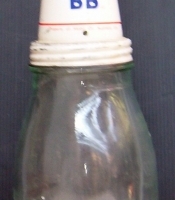 Vintage MOBIL OIL BOTTLE - plain glass one imperial quart bottle with raised text - white tin nozzle & lid with text Mobil Oil BB & FLYING HORSE e - Sold for $268 - 2014