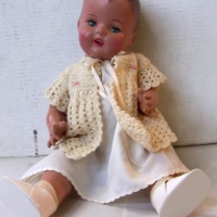1930's COMPOSITION DOLL with sleep eyes, open mouth & moulded hair - fully dressed with shoes & socks - 50cm long - Sold for $67 - 2014