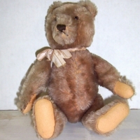 1950's STEIFF Beige mohair BEAR - fully jointed - wood filled - felt pads - long unclipped nose - 30cms long - unmarked - Sold for $244 - 2014