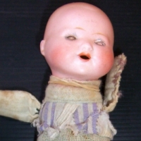 Small socket head bisque CHARACTER BABY with open mouth, sleep eyes, cloth body - marked Germany 257 - 40 - Sold for $61 - 2014