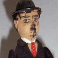 Tin c/work Schreyer & Co (early Shucco) CHARLIE CHAPLIN Little Tramp character TOY - c1920 - 16cms high - working - Sold for $244 - 2014