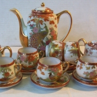 SATSUMA TEA SET with teapot, cream, sugar & 6 fine duos with different images & oriental lady's head image at bases - Sold for $85 - 2014