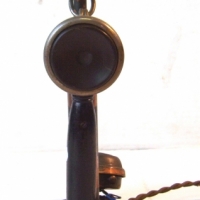 Vintage CANDLESTICK telephone -  with coppered transmitter column & receiver with black wooden handle - ornate bell embossed with a flag - Sold for $134 - 2014