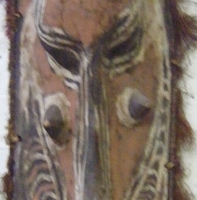 Large Carved Wooden PNG Sepik TRIBAL WALL MASK with natural fibre rim and natural ochre decoration, L68cm - Sold for $73 - 2008