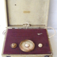 Vintage cased MARCONI Radio with dials, snake skin cover & handle - Sold for $98 - 2008