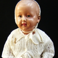 Vintage Japanese BABY CELLULOID DOLL, marked to back with cross in circle, wearing satin/lace dress and tatted jacket and bonnet, L55cm - Sold for $61 - 2009