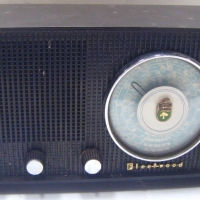1950's FLEETWOOD MANTLE RADIO - black plastic with emblem on dial, in working order, 305m L - Sold for $73 - 2009