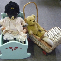 Group Lot inc Retro Dolls Cradle and Pram,  Jointed Teddy, 38cm L and Black Baby Doll with Sleeping eyes, 3 small  Porcelian Dolls - Sold for $122 - 2009