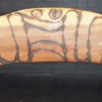 3 x ABORIGINAL pces - incl Pair of plaster wall plaques of male and female faces and large BOOMERANG - Sold for $61 - 2009