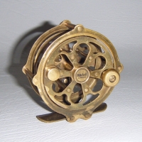 Vintage brass FISHING REEL made by Mitchell London - Sold for $73 - 2009