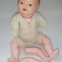 Vintage German bisque character BABY DOLL - glass eyes - open mouth with teeth - composition body with bent limbs - arms needs attaching - damage to o - Sold for $92 - 2009