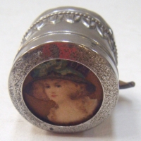 Vintage TAPE MEASURE with velvet lined compartment featuring portrait of Victorian lady to lid top - Sold for $122 - 2009