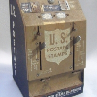 Vintage metal US POSTMASTER STAMP DISPENSER vending machine - Manufactured By Stampmasters inc - complete with instructions - Sold for $61 - 2009