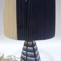 Small Retro GUNDA OZ POTTERY TABLE LAMP, Black Triangular Base with White Gloss Trailed Glaze, B&W Vinyl Ribbon Shade, H33cm - Sold for $85 - 2009