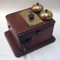 Vintage  Wall Mounted Telephone Bell Box, lovely wooden case with Brass Bells, winding handle and Brass Plaque with indicator knob to front Stamped to - Sold for $85 - 2009