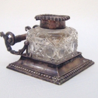 STERLING silver INK WELL - silver base with PEN HOLDER to back & CRYSTAL ink bottle with silver lid - base hallmarked BIRMINGHAM 1901 - 6cm high - Sold for $152 - 2009