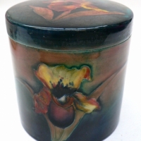 William MOORCROFT flambe lidded jar - blue/green ground (slipper) ORCHID pattern - impressed Potter to HM The Queen, 1928-1949 - small chips to edge of  - Sold for $232 - 2009