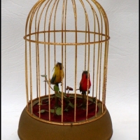 Vintage CLOCKWORK gilded bird cage with pair of colouful BIRDS, Beaks open  shut & tails wag - Sold for $232 - 2009