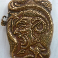 Victorian shaped brass VESTA - heavily embossed with Lucifer & dragon type creature - Sold for $110 - 2009