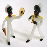 Pair of small Murano glass musicians - dark skinned playing flute & cymbals wearing white clothes & top hats - 85 cms H - Sold for $61 - 2009