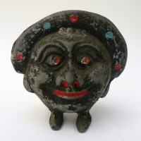 Vintage cast iron Moonface (wearing spotted hat)  Character MONEY BOX - c1900, 11cm high - Sold for $104 - 2009