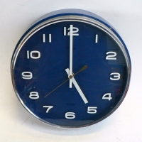 1960's METAMEC Wall Clock, Dark Blue Body with raised white numbers and chromed surround, bat Op - Sold for $73 - 2014
