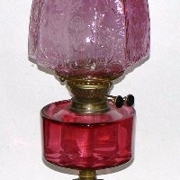 Tall Victorian style twin burner Oil Lamp with brass fittings, ruby glass bowl, pink glass shade, cast iron base with square column - 74cms H - Sold for $268 - 2014
