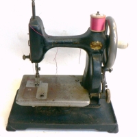 Vintage small size hand operated Little worker Sewing machine with instructions & cane basket - Sold for $146 - 2014