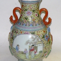 Large Chinese hand painted Famille Rose Vase heavily decorated with two round cameos featuring scenes with figures, handles to neck  - marked t - Sold for $110 - 2014