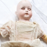 Late Victorian German bisque DOLL, sleep eyes, open mouth, composition arms, soft body & black cloth legs, wig missing, fingers broken & leg detached  - Sold for $98 - 2012