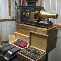 c1900  MAGIC LANTERN  by Radiguet & Massiot, Paris with approx 250 glass slides incl UK, Europe, Italy, RMS LUSITANA, fishing harbors, Old Curiosity S - Sold for $1098 - 2012