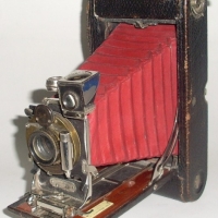 1920's Kodak Eastman 3A Folding Camera circa early 1900's with red bellows, brass lens holder, & wooden rails - Sold for $55 - 2012