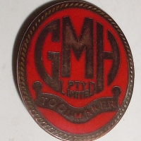 Red enamel Badge - GMH Toolmaker - made by Schlank, Adelaide - Sold for $61 - 2012