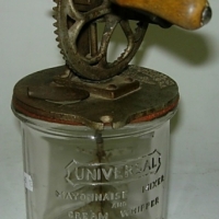 Universal Mayonnaise Mixer and Cream Whipper - glass base with embossed writing & cast metal lid with wheel & handle - made by Landers, Frary  - Sold for $110 - 2012