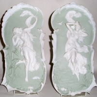Pair of Victorian Rudolstadt Volkstedt bisque wall plaques - Night & Day - pale soft green ground decorated with white female figures & borders in - Sold for $183 - 2012