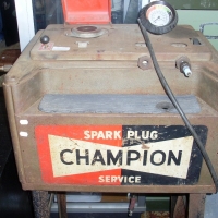 1950's Champion Spark Plug Tester/cleaner - large unit on metal frame (97cm tall) with original signage to front - Sold for $171 - 2012