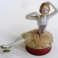 1930's ladies novelty cardboard powder box  with seated porcelain half doll to lid wearing padded ballet skirt - Sold for $67 - 2012