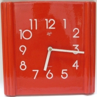 1960's 'Schatz' red ceramic Wall Clock - red ground with white numerals & hands, square shaped with paneled edges - battery operated - Sold for $67 - 2012