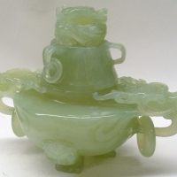 Vintage oriental Jadeite lidded vessel - heavy with carved dragon head handles and lid, on 3 feet - Sold for $92 - 2012