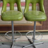 Pair 1960/70's Green Vinyl barstools with chrome base and foot rest and swivel tops - Sold for $67 - 2012