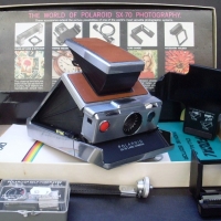 POLAROID SX 70 CAMERA in original box with accessories inc SELF TIMER, Tripod mount, etc and instruction booklet, looks to be good condition - Sold for $73 - 2013
